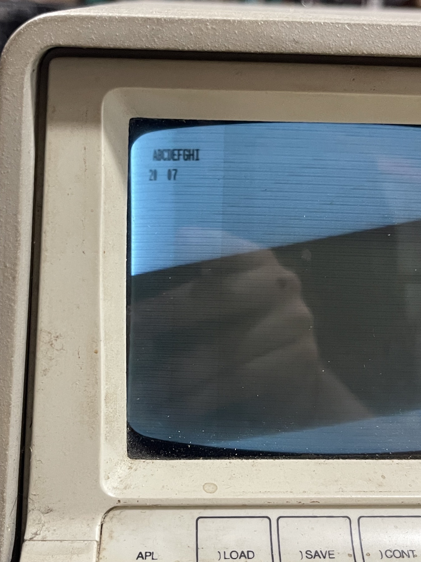 The IBM 5100's CRT screen powered on, showing characters